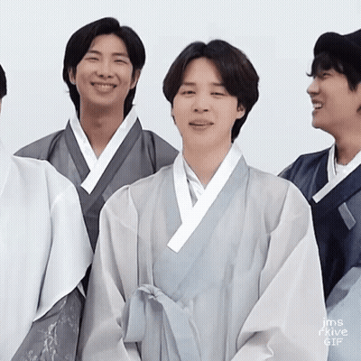 Young Men In Kimonos Smiling For Camera GIF