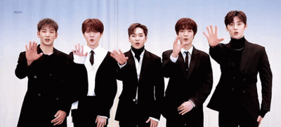 Young Men In Suits Waving GIF