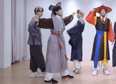 Young Men In Traditional Korean Clothing Dancing GIF