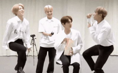 Young Men In White And Black Standing Sitting GIF