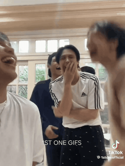 Young Men Laughing Covering Mouths GIF