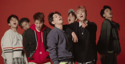 Young Men Laughing On Red Background GIF