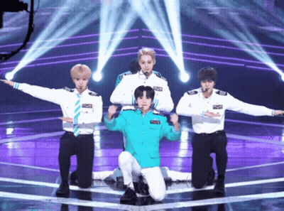 Young Men Performing On Stage With Blue Jacket Saying Captain GIF