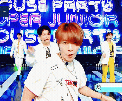 Young Men Performing On Stage With Upper Junior Sign GIF