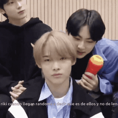 Young Men Posing For Picture With Red Object GIF