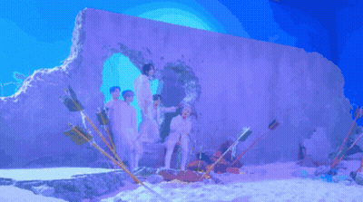 Young Men Posing In Front Of Hole In Wall GIF
