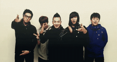 Young Men Posing, One Wearing Blue Jacket GIF