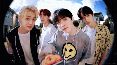 Young Men Posing With Smiley Face Shirt GIF