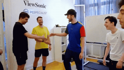 Young Men Shaking Hands In Front Of ViewSonic Wall GIF