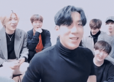 Young Men Sitting Around Table One In Black Turtleneck GIF