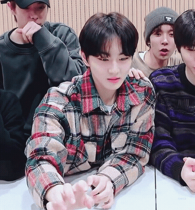 Young Men Sitting Around Table One In Plaid Shirt GIF