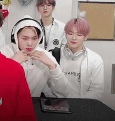 Young Men Sitting Around Table Wearing Headphones GIF