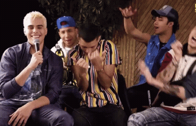 Young Men Sitting At Microphone One In Striped Shirt GIF