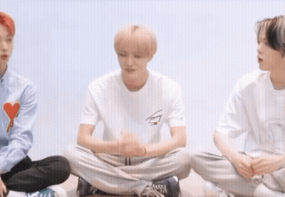 Young Men Sitting In A Circle Cross-Legged GIF