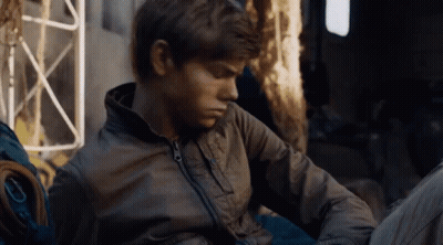Young Men Sitting In Front Of Wall Saying Clevver GIF