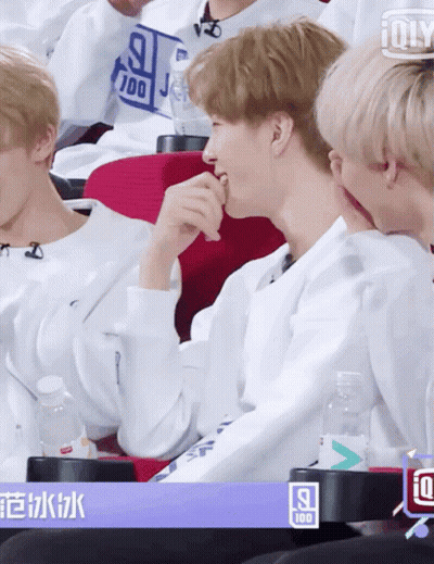 Young Men Sitting In Theatre With 100 Sign GIF
