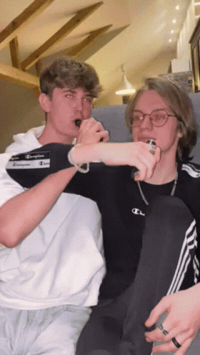 Young Men Sitting On A Couch GIF