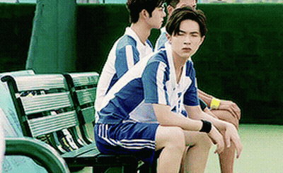 Young Men Sitting On Bench On Tennis Court GIF