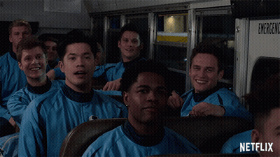 Young Men Sitting On Netflix Bus GIF
