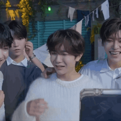 Young Men Smiling At Tablet GIF