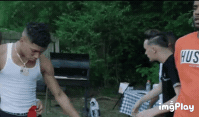 Young Men Standing By Barbecue Grill GIF