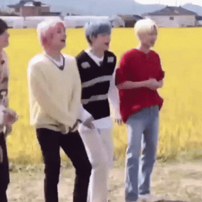 Young Men Standing In Front Of A Field GIF