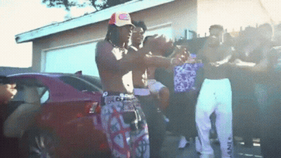 Young Men Standing In Front Of Pink Car GIF