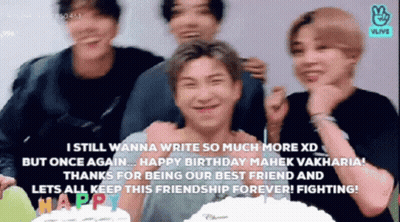 Young Men Standing Next To Each Other In Front Of A Cake GIF