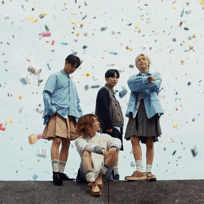 Young Men Standing On Wall With Confetti GIF