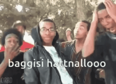Young Men Standing With Hands On Heads GIF