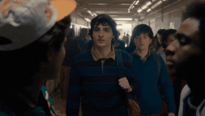 Young Men Walking Hallway NFL Hat GIF