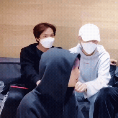 Young Men Wearing Masks Sitting Couch GIF
