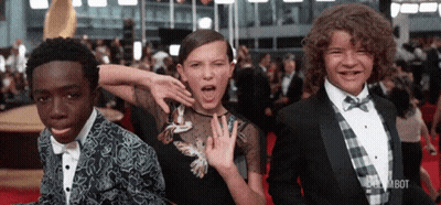 Young People Standing On Red Carpet GIF