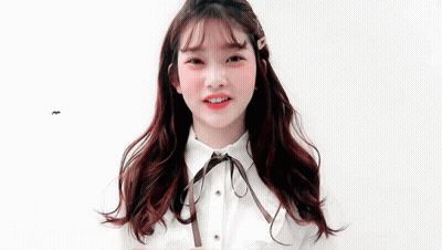 Young Red Haired Girl With Brown Bow Smiling GIF