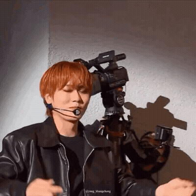 Young Red-Haired Man Facing Camera GIF