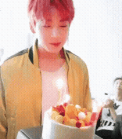 Young Red-Haired Man Holding Cake With Candle GIF