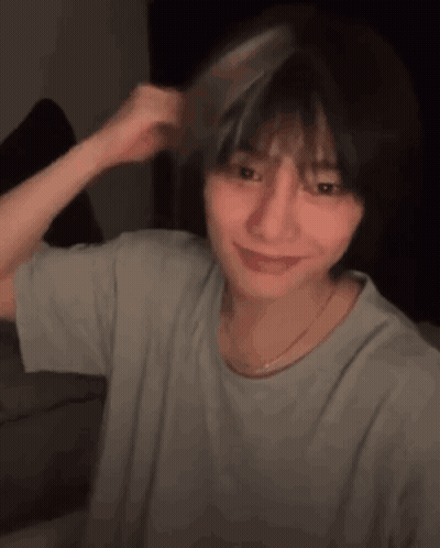 Young Woman Brushing Hair With Comb Smiling GIF