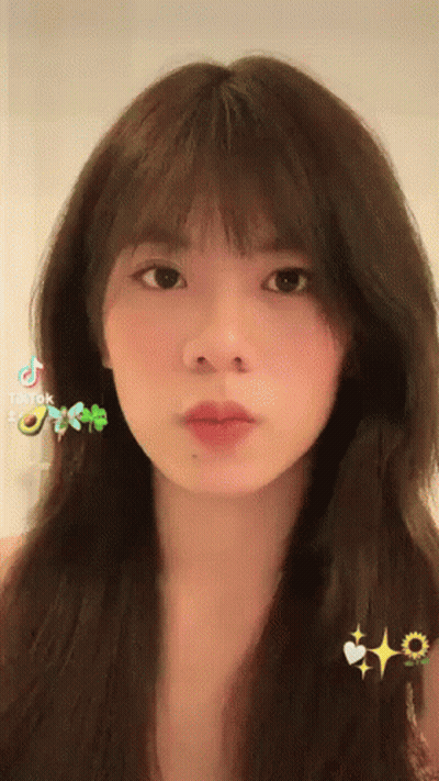 Young Woman Close Up With Long Hair And Bangs GIF