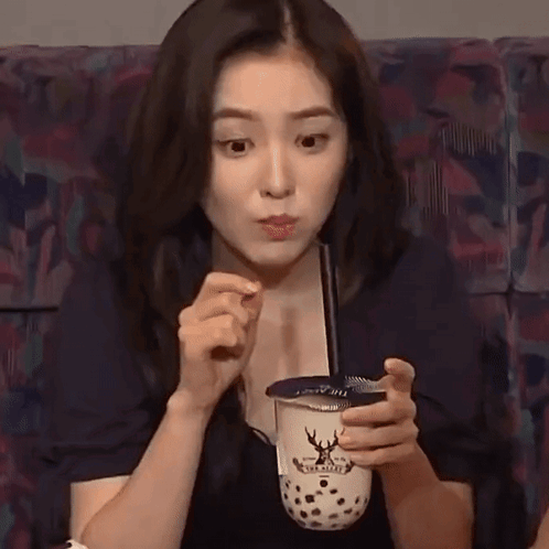 Young Woman Holding Bubble Tea GIF