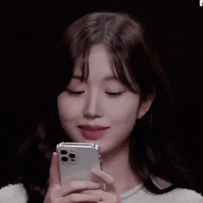 Young Woman Holding Cell Phone GIF