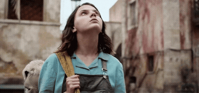 Young Woman Holding Stuffed Animal Looking Up GIF