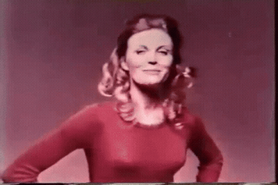Young Woman In Black Bra And Green Shorts GIF