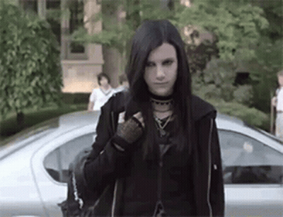 Young Woman In Black Jacket Standing In Front Of Car GIF