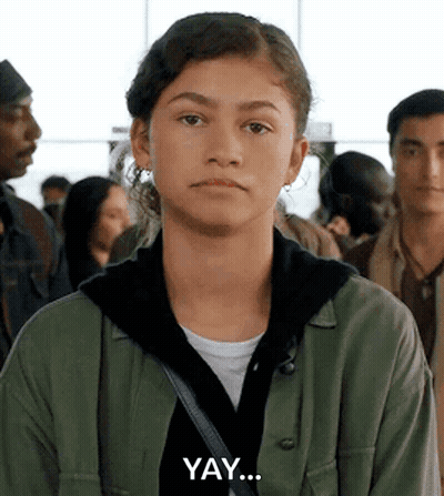 Young Woman In Green Jacket Making Funny Face GIF