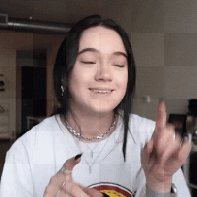 Young Woman In White T-Shirt Giving Middle Finger GIF