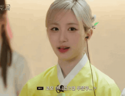Young Woman In Yellow Kimono With Headphones Talking GIF