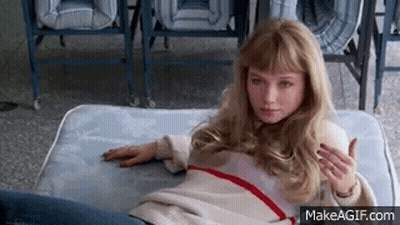Young Woman Laying On Mattress GIF