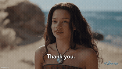 Young Woman Saying Thank You In Front Of Moana Poster GIF