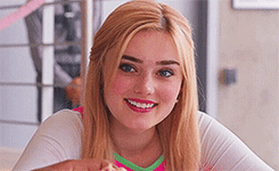 Young Woman Smiling And Eating Pizza GIF