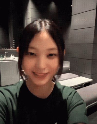 Young Woman Smiling In Green Shirt GIF